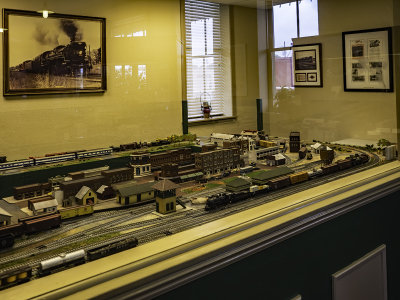 Model train setup inside depot. 