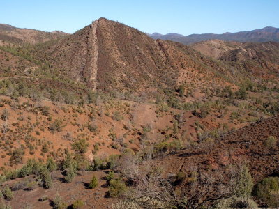 A one-stripe hill in a dry landscape