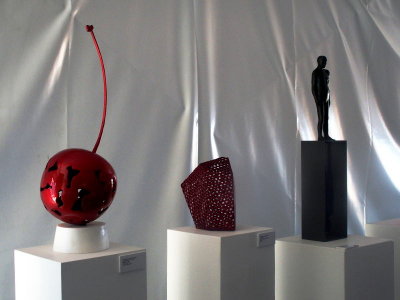 Three small sculptures at the front of the sculpture tent