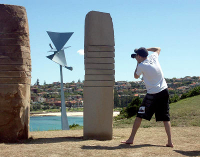 Two sculptures and a photographer