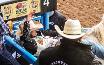 Bronc Rider Kyle Charley bolts out of the chute on 202 Stardust