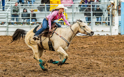 Barrel Racing competitor races to the finish line