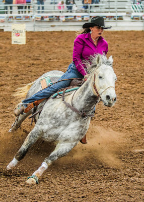 Barrel Racing competitor heads toward the second barrel