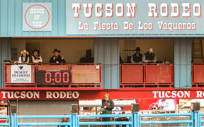 Officials and announcers prepare for the beginning of the rodeo