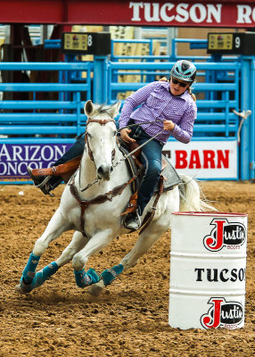 Junior Rodeo Barrel Racing competitor rounds the first barrel