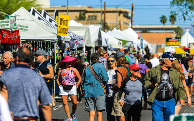 Crowds and vendor tents on the street at the 4th Avenue Street Fair