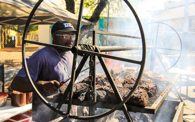 Tending to the BBQ at the 4th Avenue Street Fair