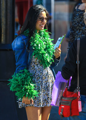 Woman handing out fliers at the 4th Avenue Street Fair