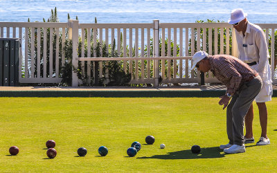 Bocce Ball players watch a roll in Laguna Beach