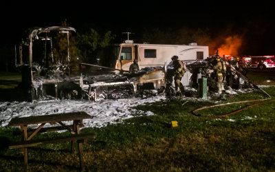 Firefighters comb through the smoldering remains of my RV
