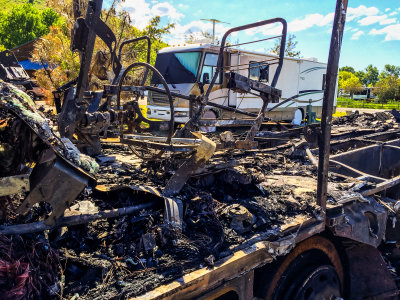 The drivers seat and steering wheel of my burned RV
