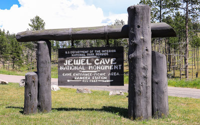 Park sign at the historic entrance to Jewel Cave National Monument 