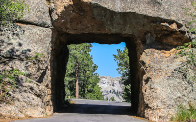 View of Mt Rushmore through the Scovel Johnson Tunnel along the Iron Mountain Road in Custer State Park