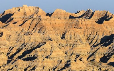 The setting sun is reflected on the hills in Badlands National Park