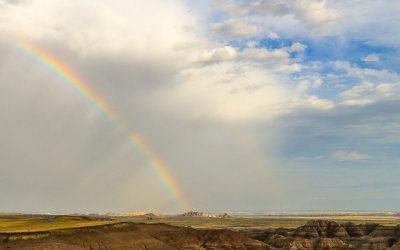 Double rainbow lands on mounds in Badlands National Park