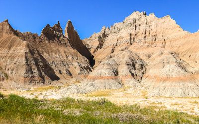 Jagged peaks rise above the prairie in Badlands National Park
