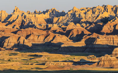 Pinnacles, peaks and mounds in the early morning sun in Badlands National Park