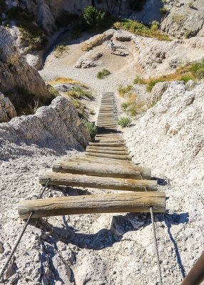 View down the steep wooden ladder along the Notch Trial in Badlands National Park