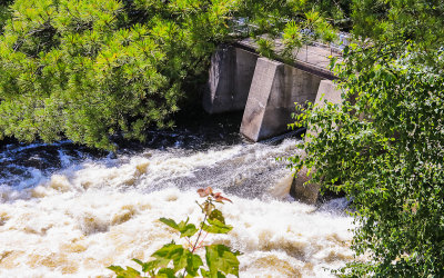 Water flows through the Kettle Falls Dam in Voyageurs National Park