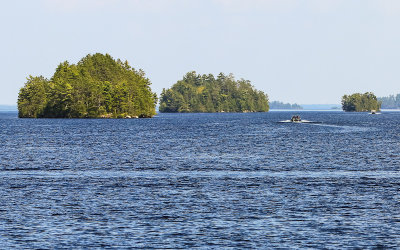 Park islands and boaters on Rainy Lake in Voyageurs National Park