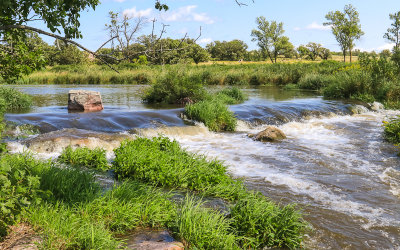 Water streams out of Lake Hiawatha in Pipestone National Monument