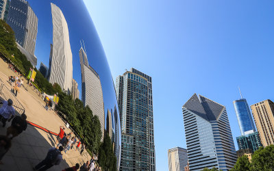 View of downtown buildings in and next to the Bean in Millennium Park in Chicago