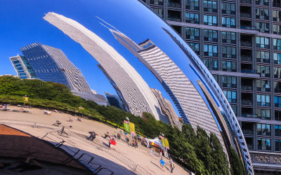 Buildings warped by the curve of the Bean in Millennium Park in Chicago