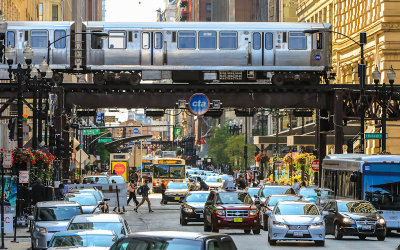 Chicago Transit Authority train over a busy downtown street in Chicago