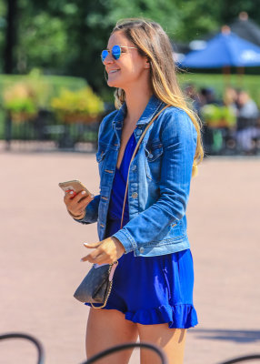 Tourist taking selfies in Millennium Park in Chicago