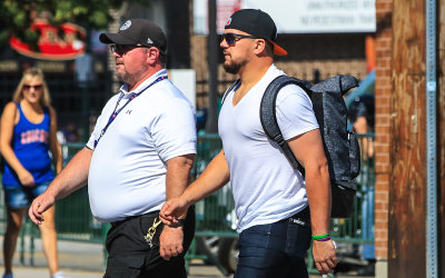 Cubs outfielder Kyle Schwarber arrives before the game at Wrigley Field