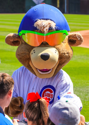 Cubby Bear signs autographs for young fans at Wrigley Field