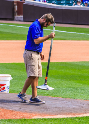 Grounds crew member gets the pitcher’s mound game ready at Wrigley Field