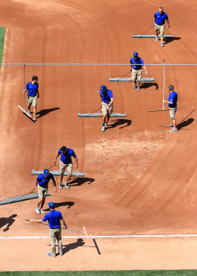 Grounds Crew rakes the infield between innings at Wrigley Field