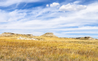 Grassy plains and clouds over the Daemonelix Trail in Agate Fossil Beds National Monument