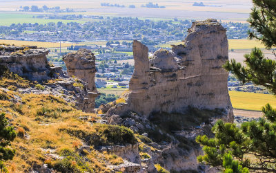 The city of Scottsbluff behind Saddle Rock in Scotts Bluff National Monument