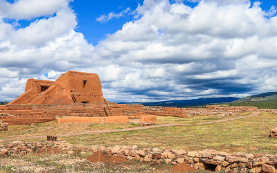 Pecos church (1717) and convento ruins under cloudy skies in Pecos National Historical Park