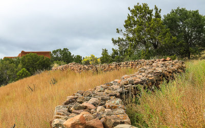 Mission ruins with the church in the background in Pecos National Historical Park