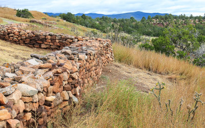 Pecos mission wall on a hillside in Pecos National Historical Park