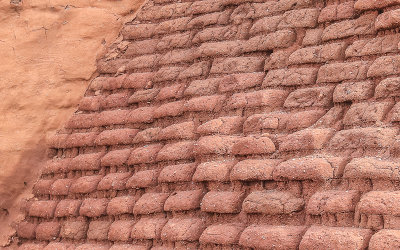 Exposed adobe bricks on the side of the Pecos church ruins in Pecos National Historical Park
