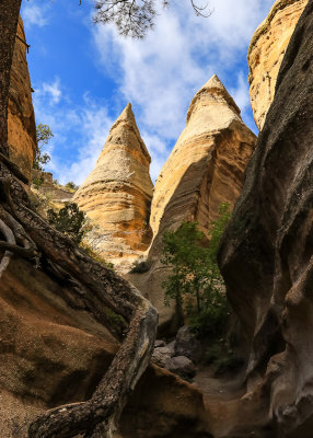 Tent rock formations towering above the Slot Canyon Trail in Kasha-Katuwe Tent Rocks National Monument