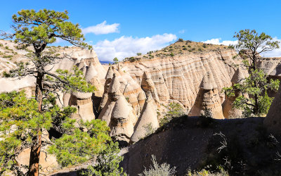 Trees frame the tent rock formations in Kasha-Katuwe Tent Rocks National Monument