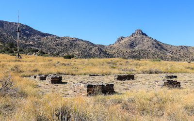 Storehouse ruins, the parade grounds and Helens Dome in the background in Fort Bowie National Historic Site