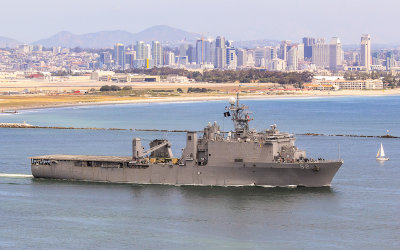 US Navy ship with the city of San Diego in the distance