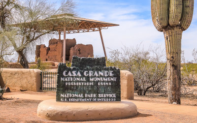 The Great House stands beyond the monument sign in Casa Grande Ruins National Monument 