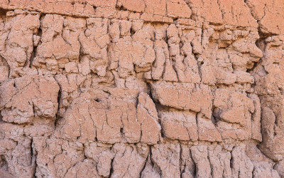 Close up of a weather worn exterior caliche wall in Casa Grande Ruins National Monument