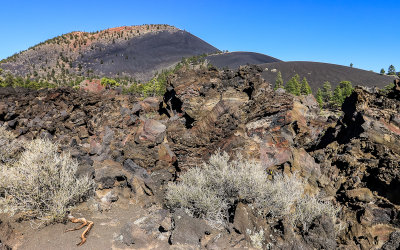 Sunset Crater (left) and lava from the Bonito Vista Trail in Sunset Crater Volcano National Monument