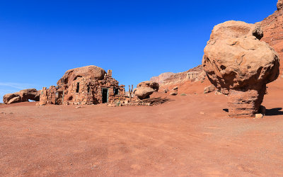 Ruins and balanced rock near the town of Cliff Dwellers in Vermilion Cliffs National Monument