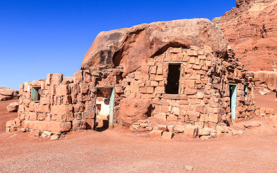 Dwelling built into a large rock in Vermilion Cliffs National Monument