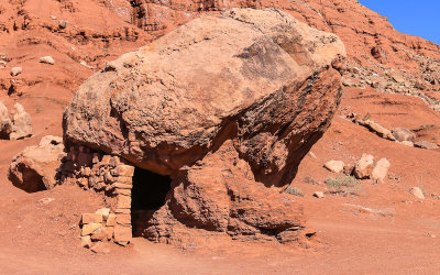 Small room built under a boulder in Vermilion Cliffs National Monument