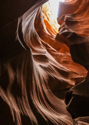 Sunlight highlights the lines in the Navajo Sandstone in Antelope Canyon